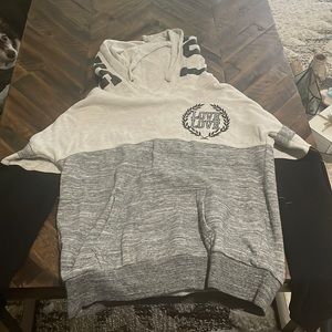Black, gray and striped hoodie company is reflex size is women’s small
